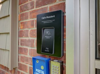 A sign on a wall that says "Call a Resident" is displayed.